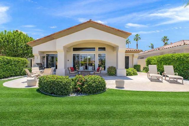 a view of a patio with a yard