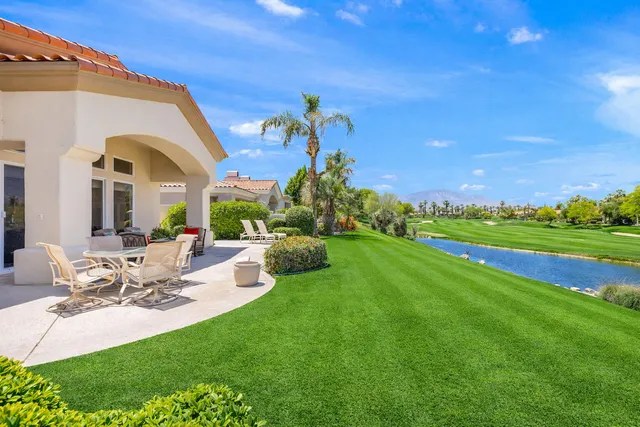 an aerial view of a house with outdoor space pool seating area and yard