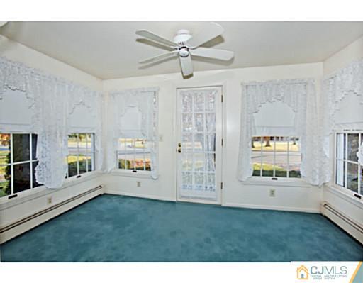 348 Ridge Road Dayton, NJ 08810 - Photo 2 of 21 a living room with furniture and window