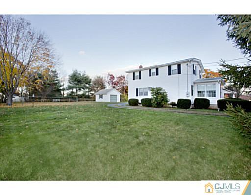 348 Ridge Road Dayton, NJ 08810 - Photo 17 of 21 a view of house with a big yard
