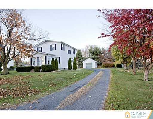 348 Ridge Road Dayton, NJ 08810 - Photo 21 of 21 a front view of a house with a yard