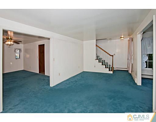 348 Ridge Road Dayton, NJ 08810 - Photo 4 of 21 a view of an empty room and workspace