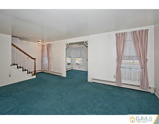 348 Ridge Road Dayton, NJ 08810 - Photo 5 of 21 a view of an empty room with stairs