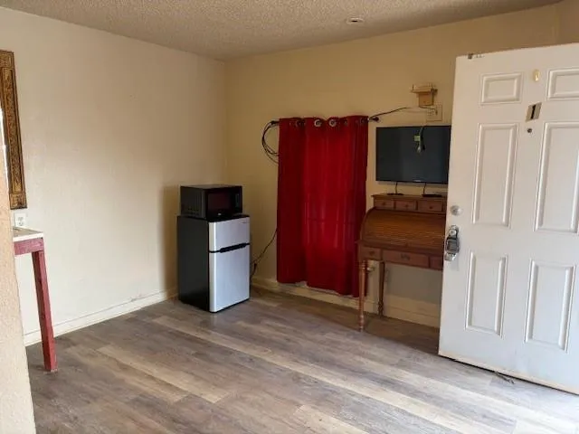 a kitchen with stainless steel appliances a refrigerator and a stove