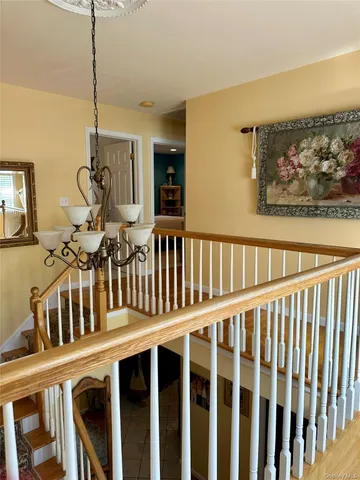 a view of a porch with wooden floor