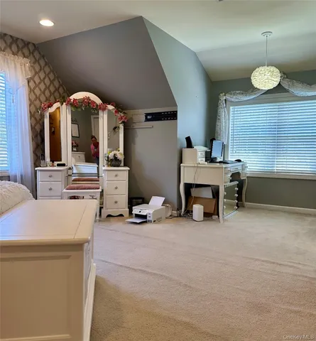 a view of a livingroom with furniture and window
