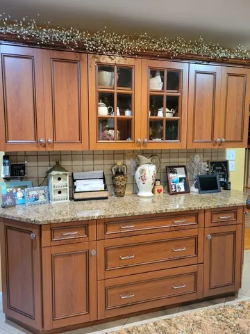 a kitchen with stainless steel appliances granite countertop a sink and cabinets