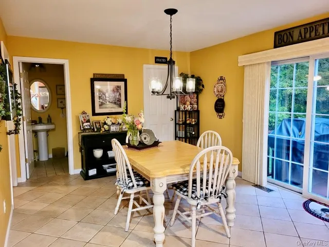 a dining room with furniture and window