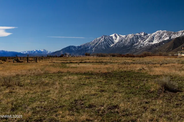a view of a large body of water with a mountain in the background