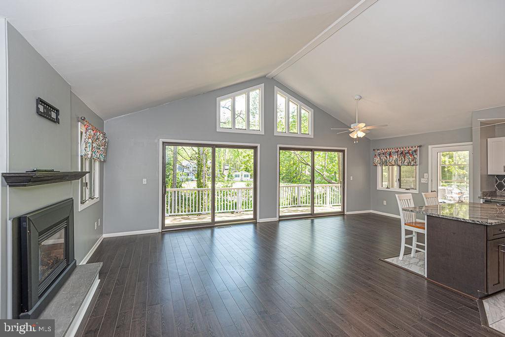 63 Drawbridge Road Ocean Pines, MD 21811 - Photo 18 of 102 a view of an empty room with wooden floor and a window
