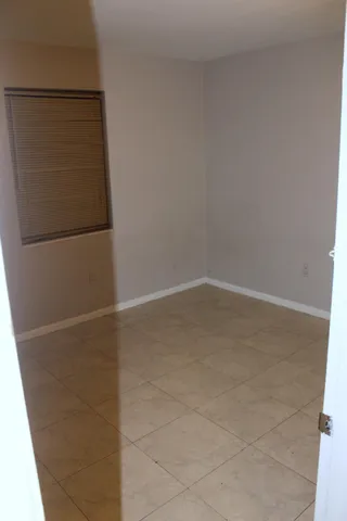 a white toilet sitting next to a bath tub and a shower