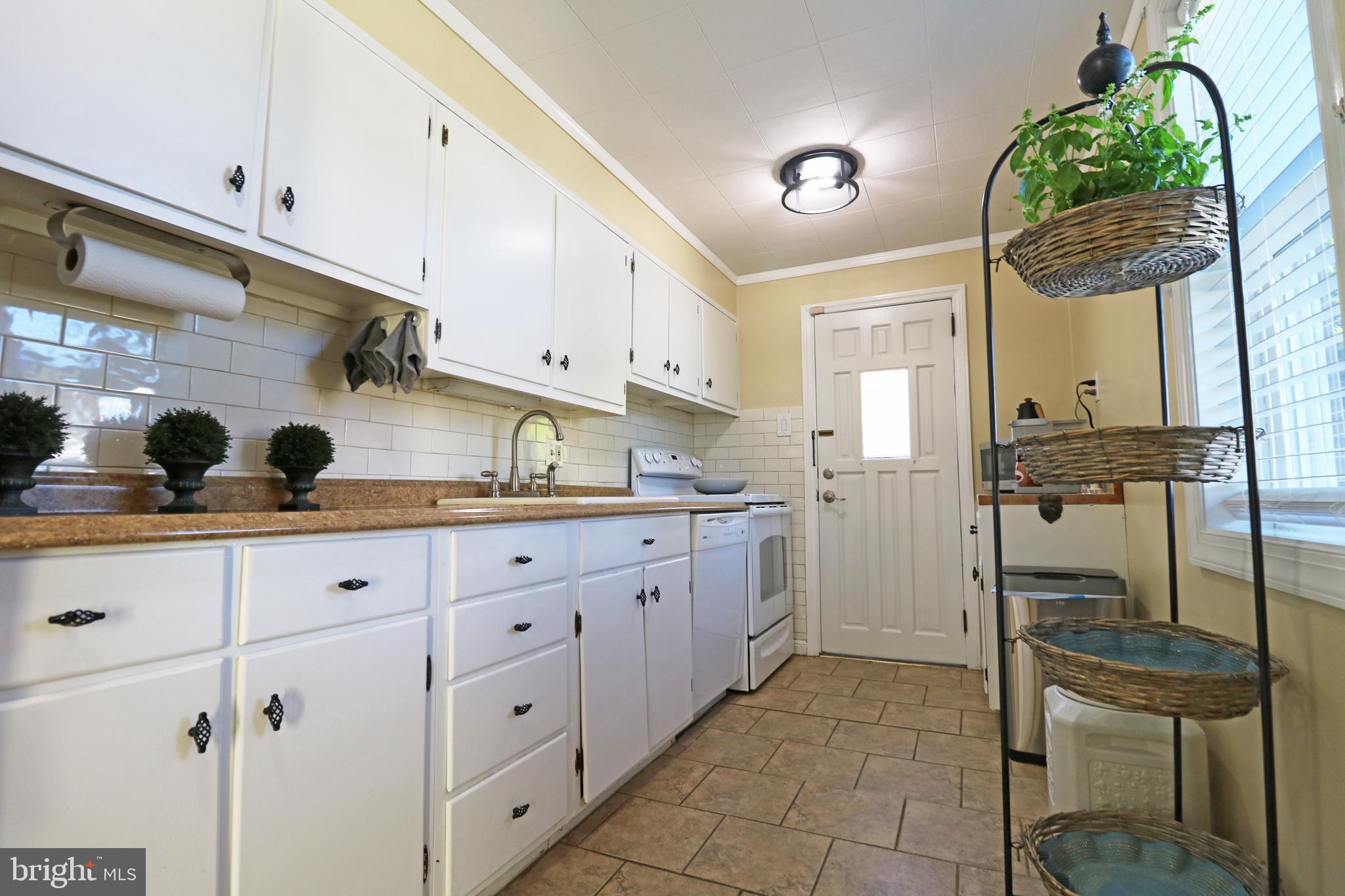 29 Pleasant Road Broomall, PA 19008 - Photo 15 of 46 a kitchen with a sink and cabinets