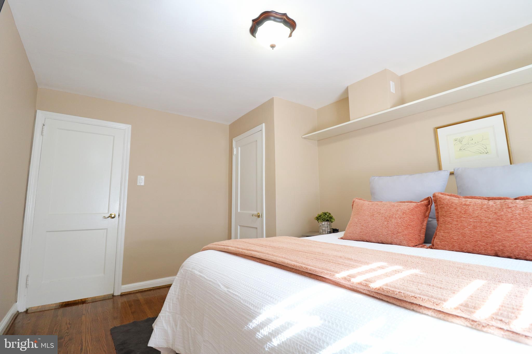 29 Pleasant Road Broomall, PA 19008 - Photo 22 of 46 a bedroom with a bed and wooden floor