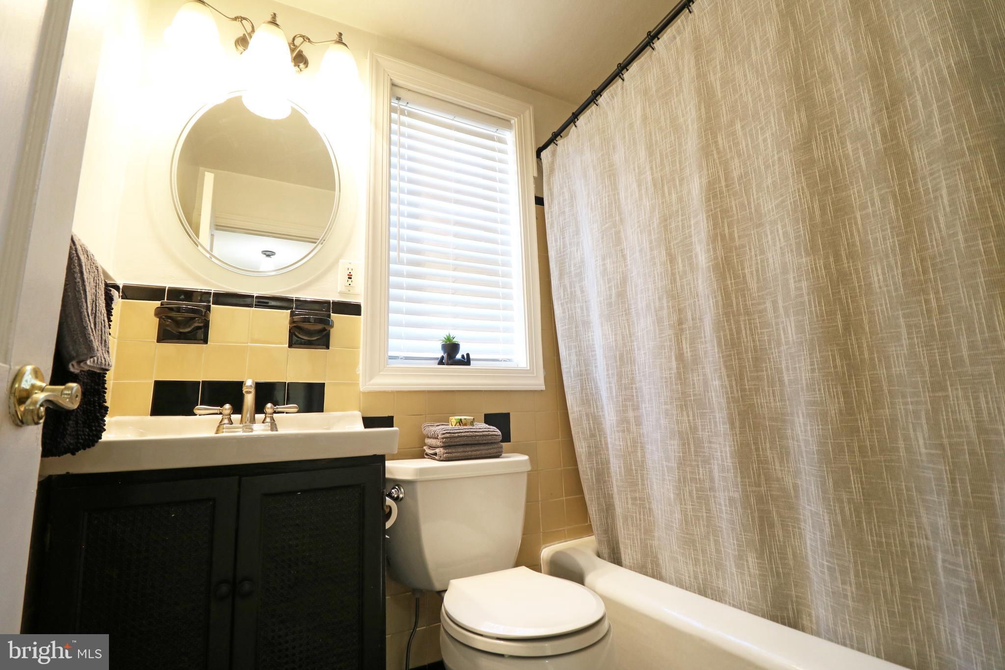 29 Pleasant Road Broomall, PA 19008 - Photo 25 of 46 a bathroom with a sink a toilet and a mirror