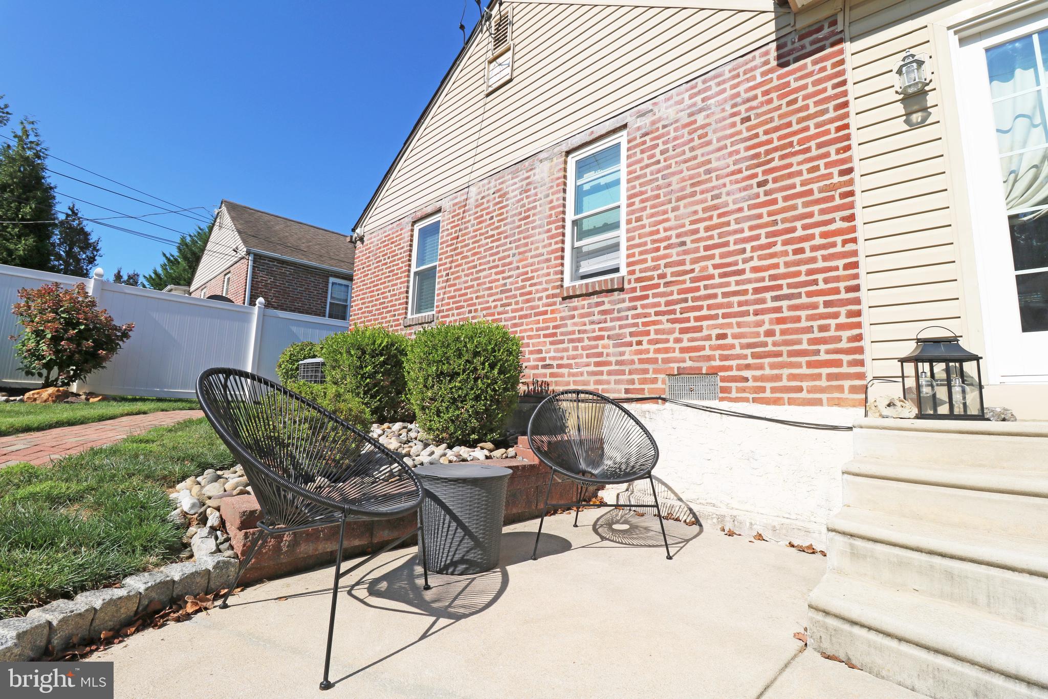 29 Pleasant Road Broomall, PA 19008 - Photo 35 of 46 a view of a chairs and table in the back yard of the house