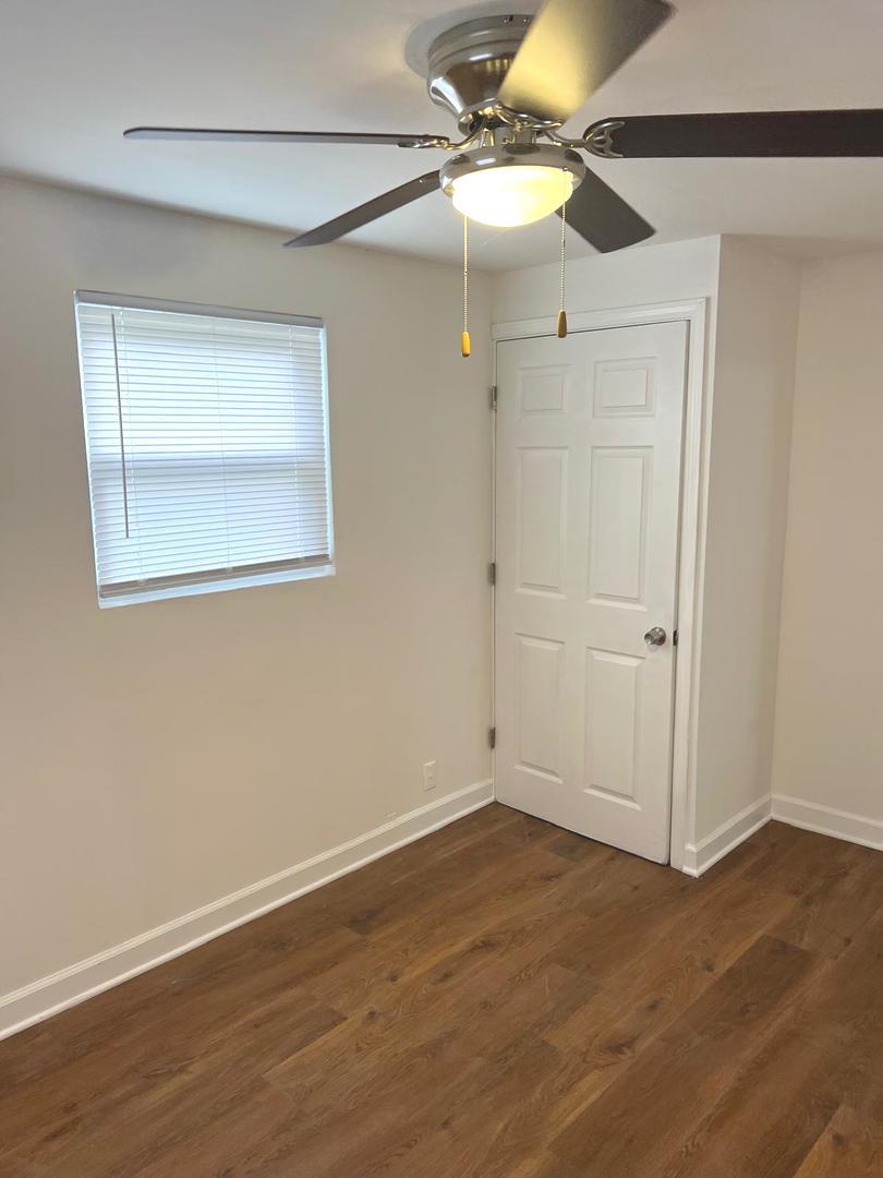 3101 Emery Lane Robbins, IL 60472 - Photo 16 of 22 a view of an empty room with wooden floor