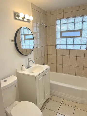 a bathroom with a sink a toilet and a bathtub