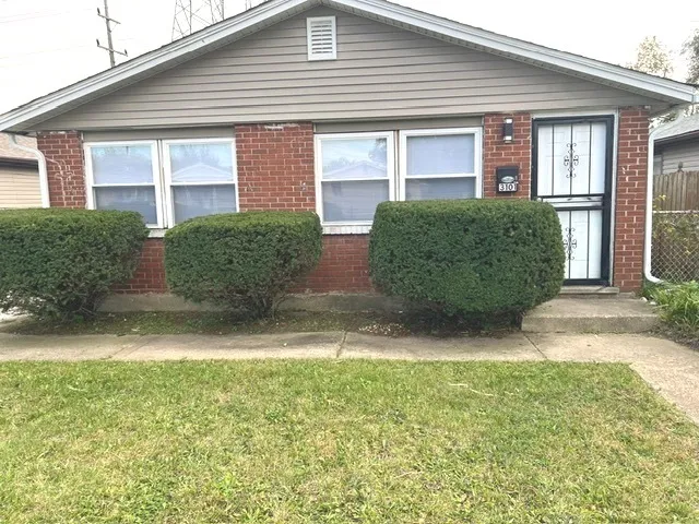 front view of a house and a yard