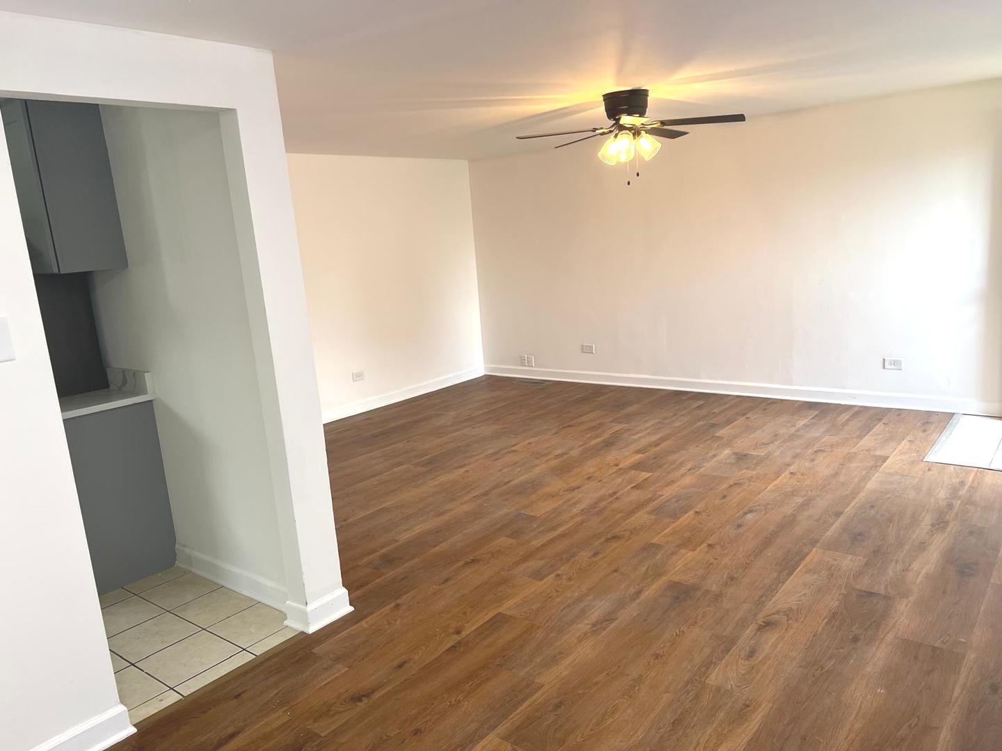 3101 Emery Lane Robbins, IL 60472 - Photo 4 of 22 wooden floor in an empty room with a window