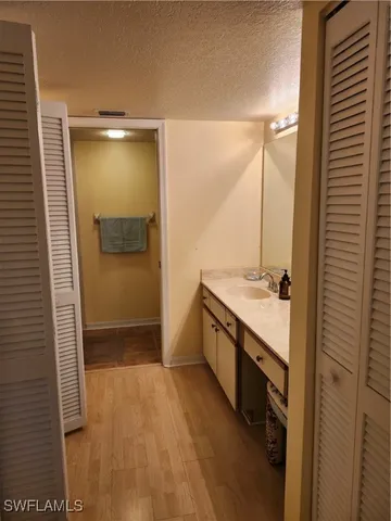 a bathroom with a sink and mirror