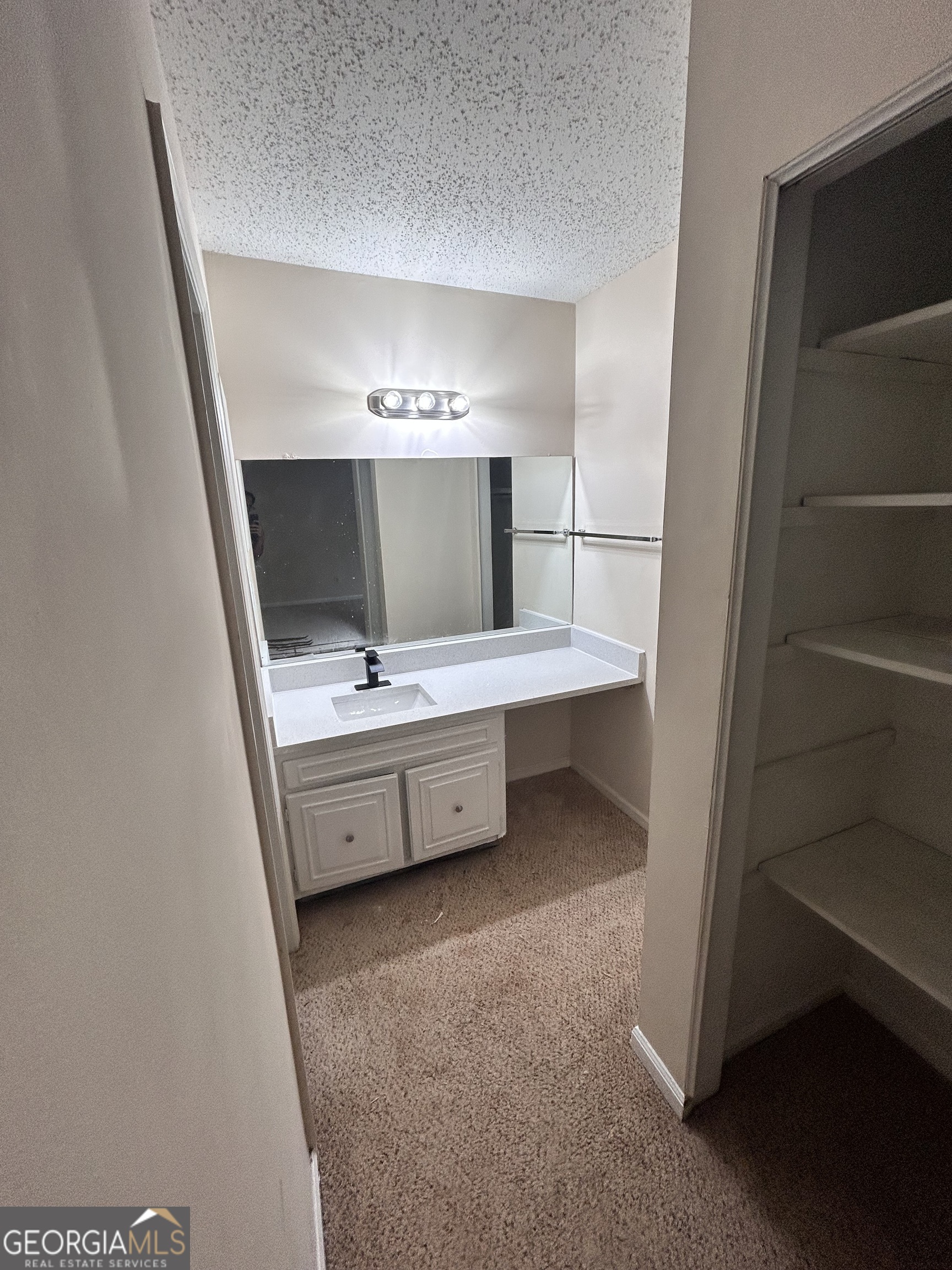2033 Oak Park Lane Decatur, GA 30032 - Photo 14 of 15 a bathroom with a sink a vanity and a mirror