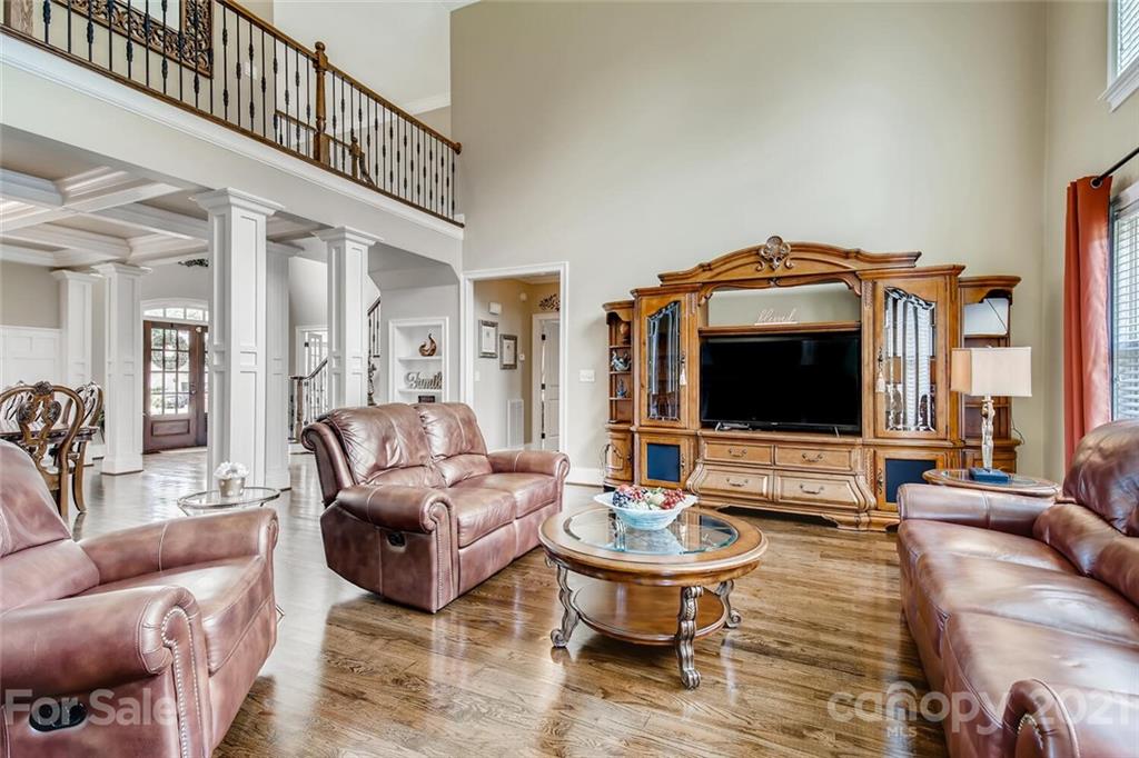 6671 Fox Ridge Circle Davidson, NC 28036 - Photo 8 of 26 a living room with furniture and a flat screen tv