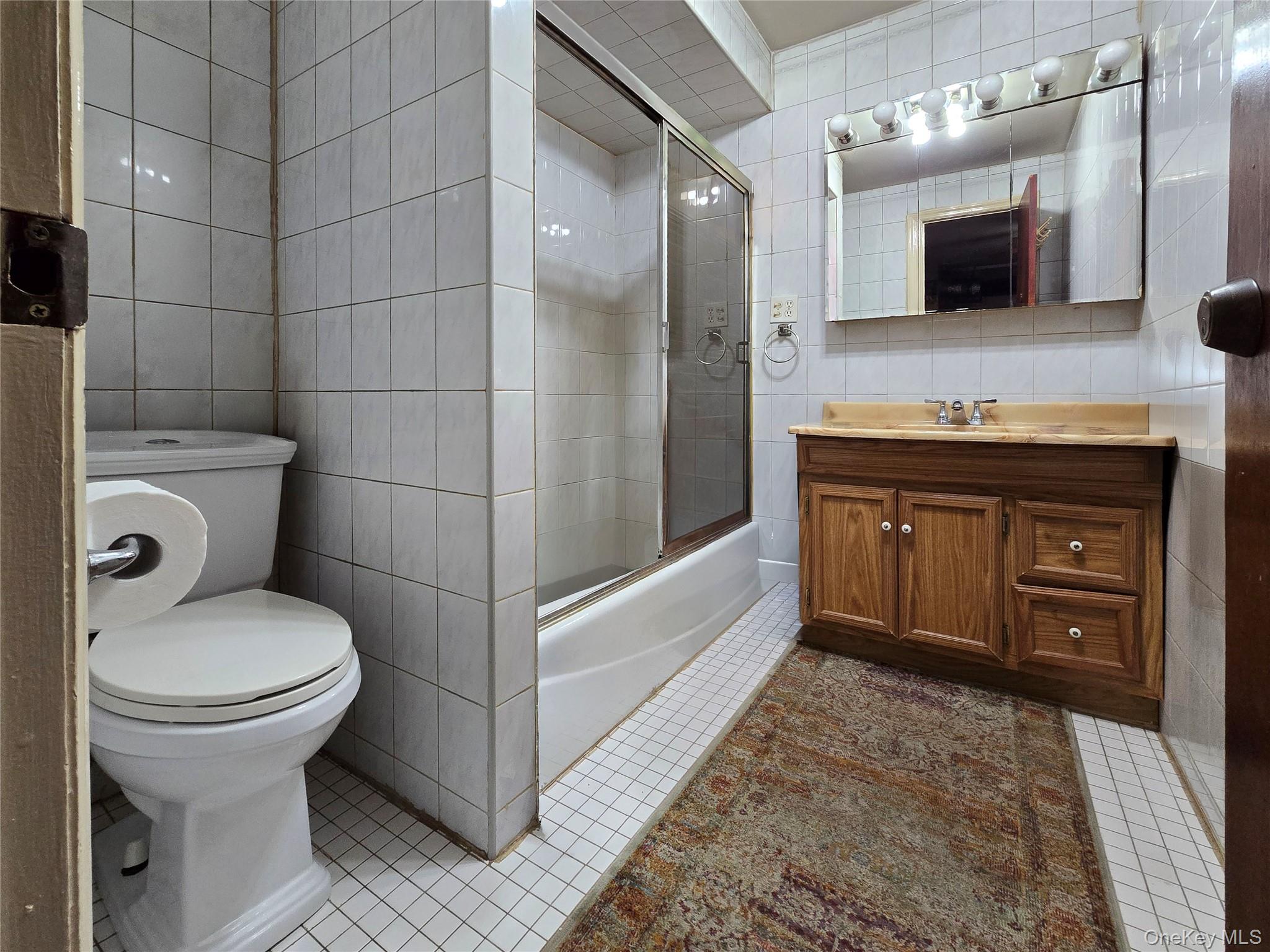 97 Hawkins Street Bronx, NY 10464 - Photo 14 of 20 a bathroom with a sink and a mirror