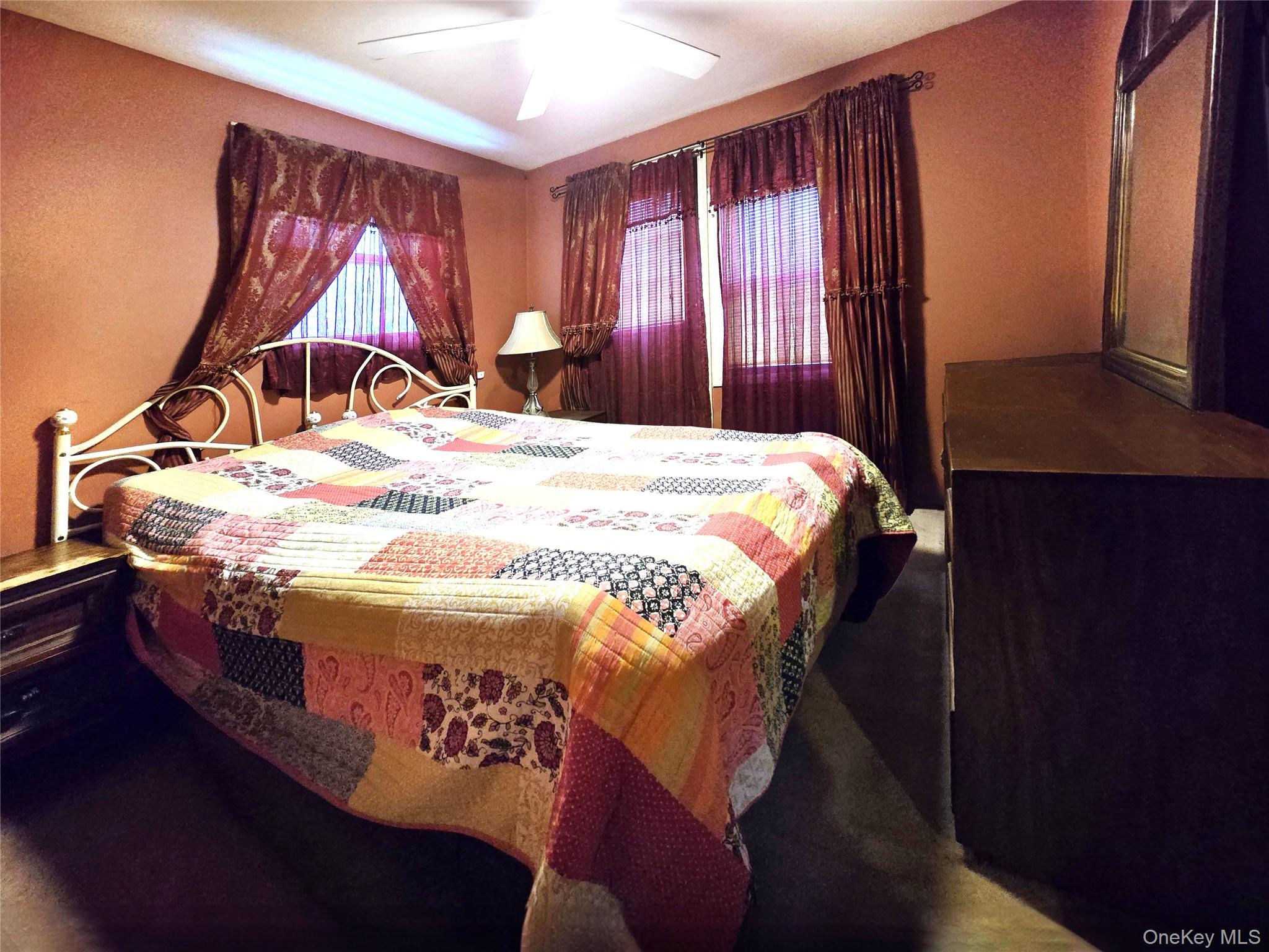 97 Hawkins Street Bronx, NY 10464 - Photo 16 of 20 a bedroom with a bed and a window