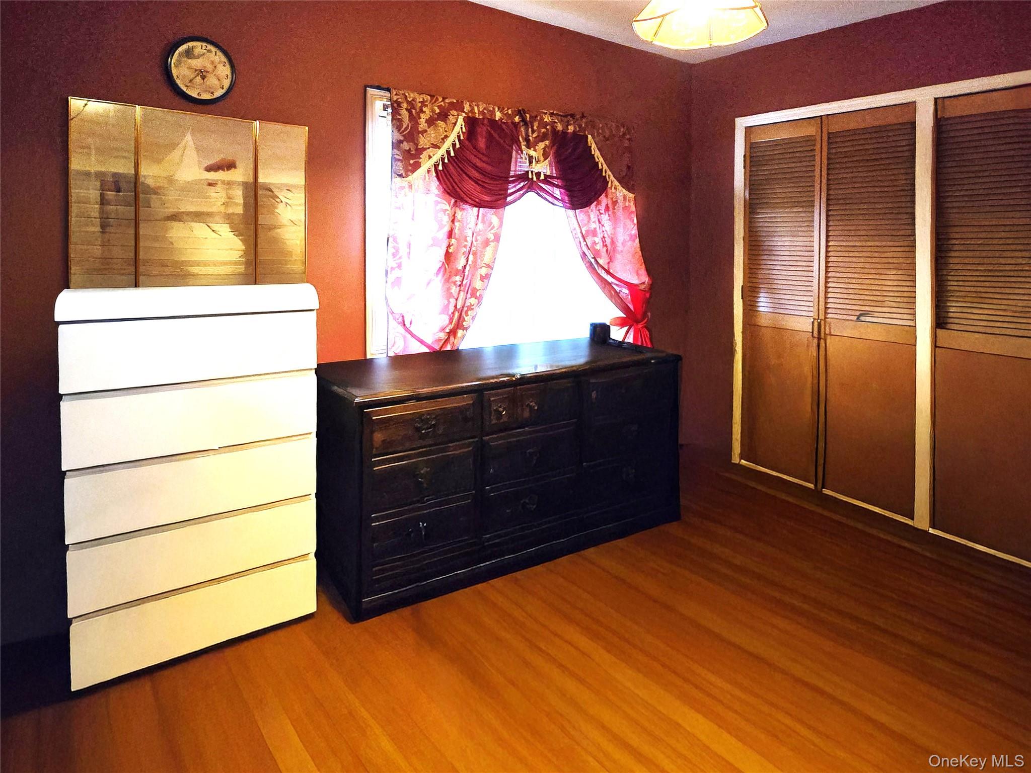 97 Hawkins Street Bronx, NY 10464 - Photo 18 of 20 a room with a dresser and a window