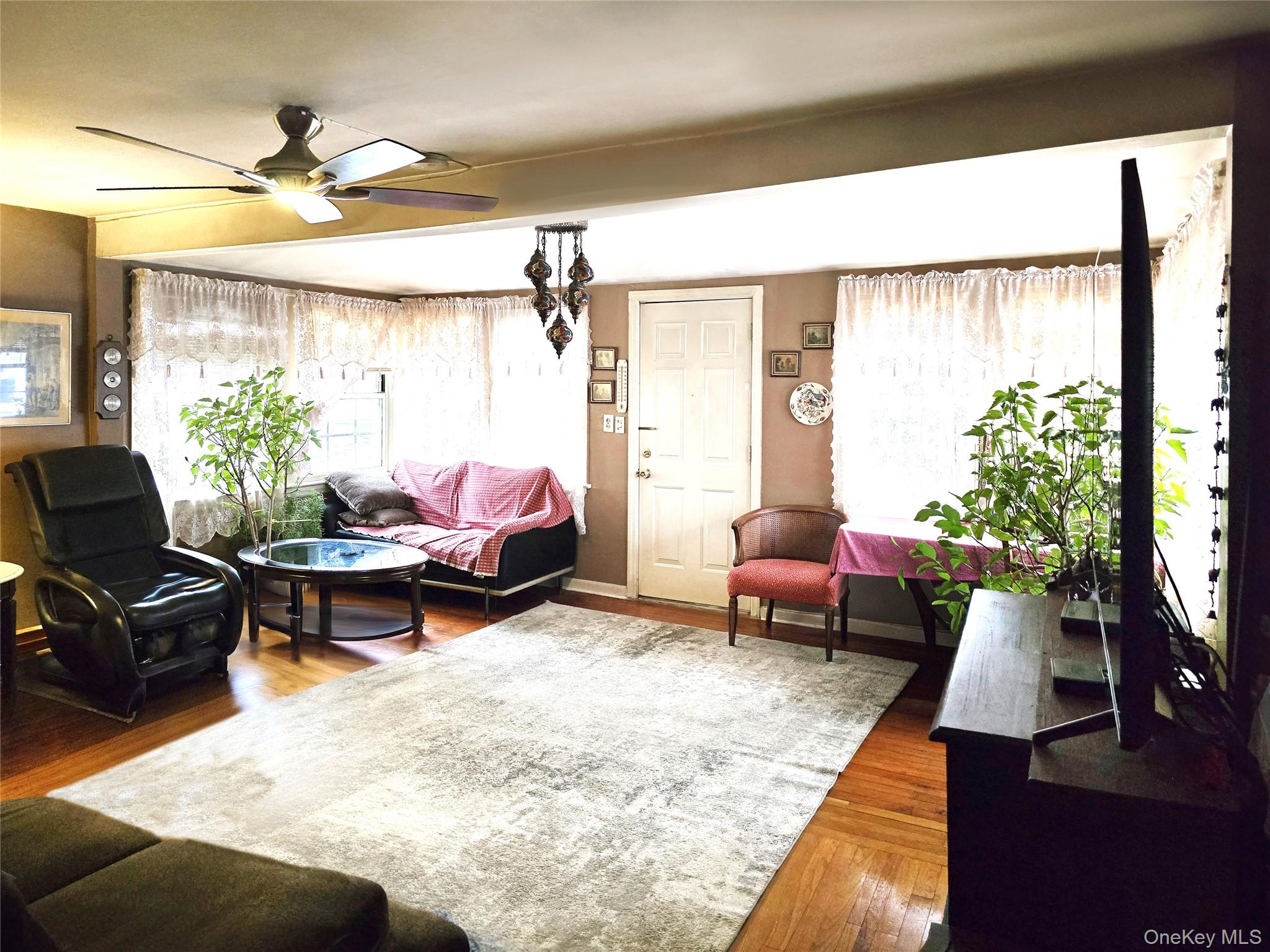97 Hawkins Street Bronx, NY 10464 - Photo 2 of 20 a living room with furniture and a large window