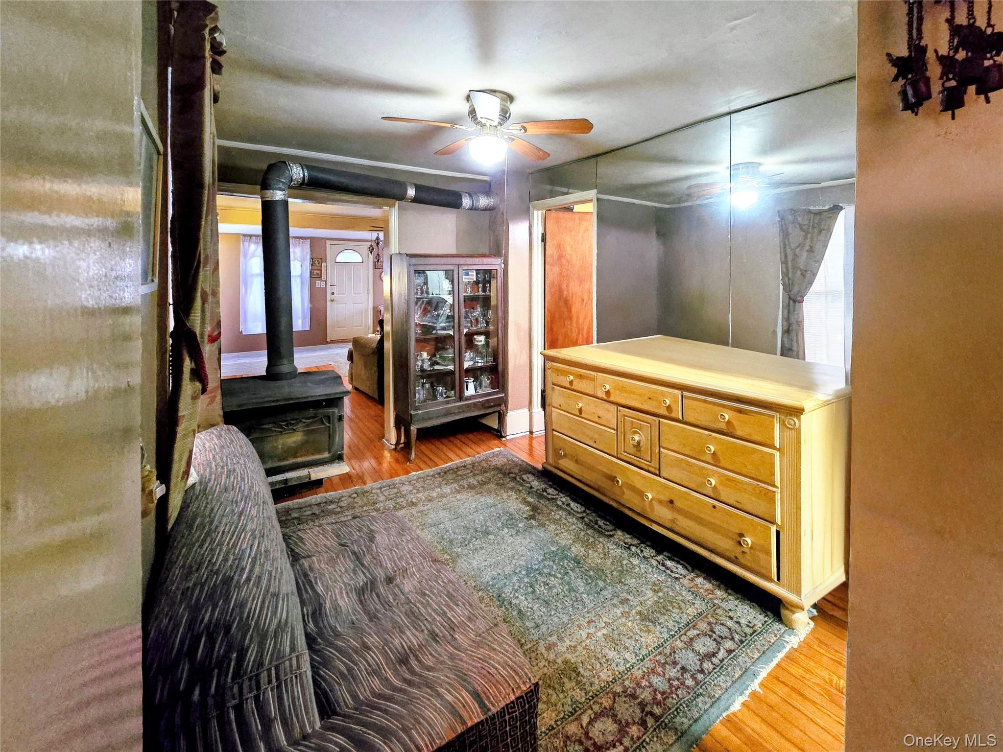 97 Hawkins Street Bronx, NY 10464 - Photo 7 of 20 a room with furniture and a flat screen tv