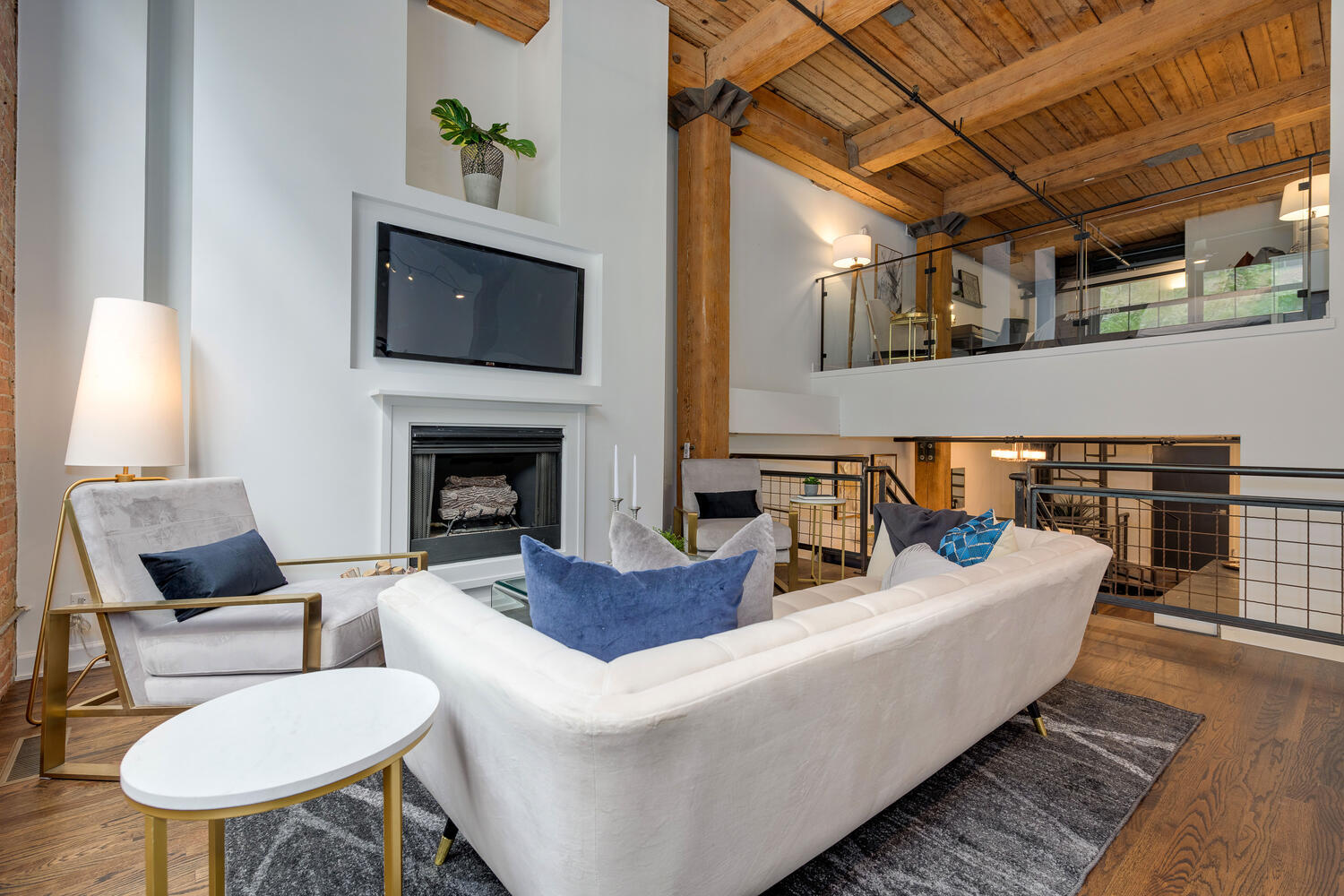 1000 West Washington Boulevard, Unit 148 Chicago, IL 60607 - Photo 12 of 29 a living room with furniture and a fireplace