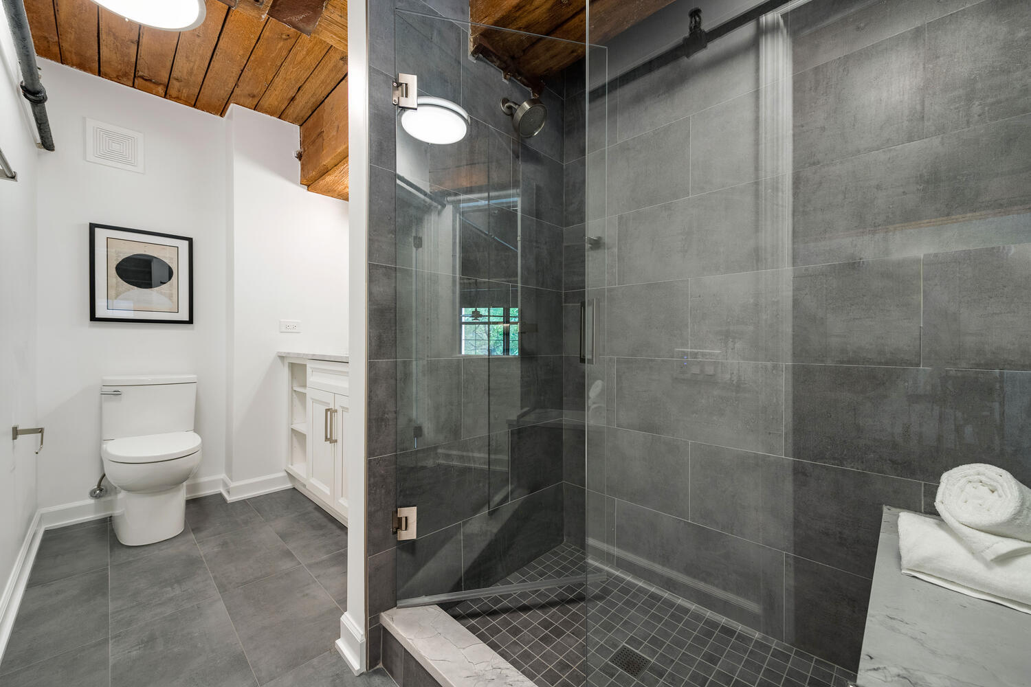 1000 West Washington Boulevard, Unit 148 Chicago, IL 60607 - Photo 18 of 29 a bathroom with a toilet and a shower