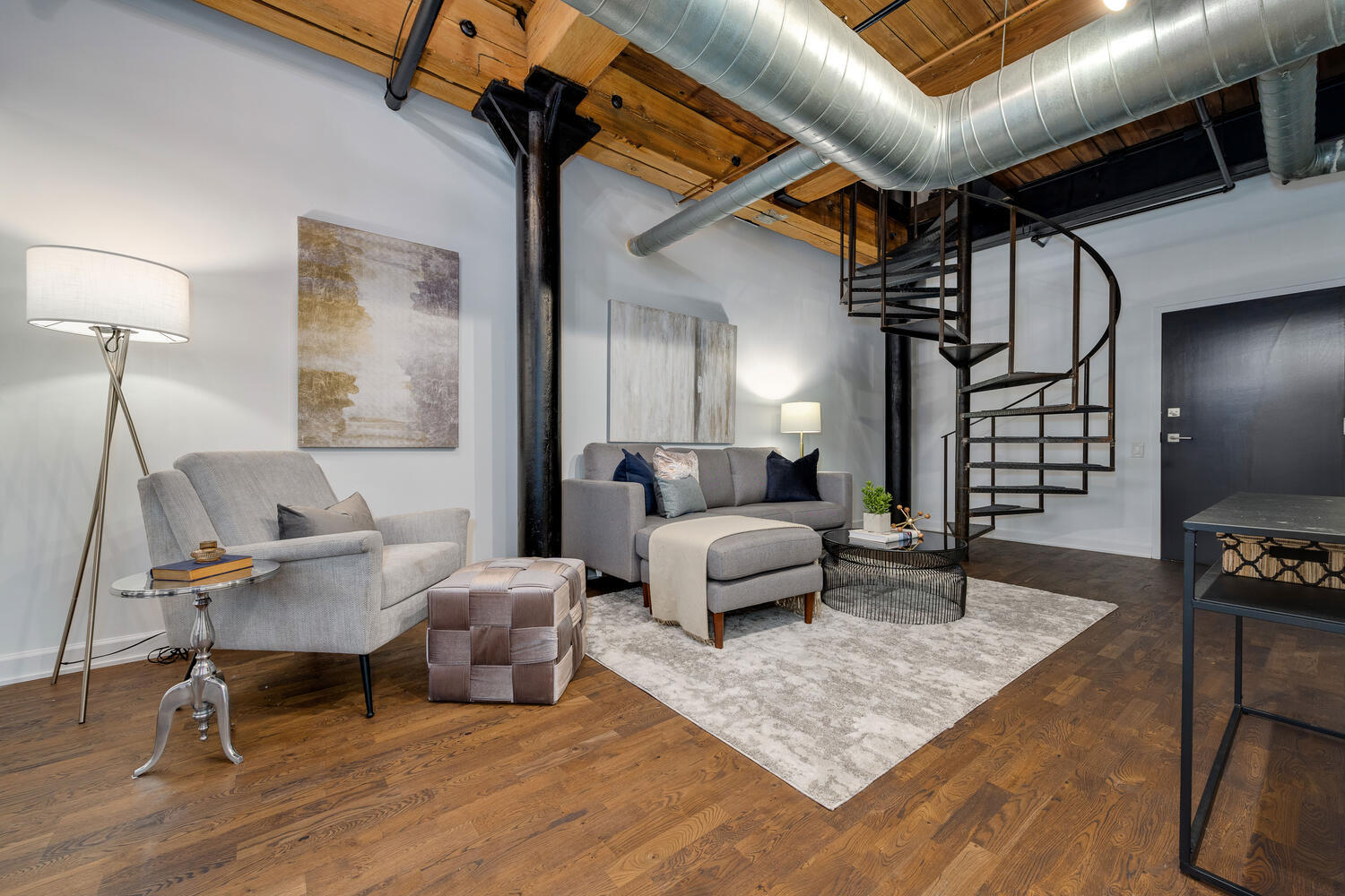 1000 West Washington Boulevard, Unit 148 Chicago, IL 60607 - Photo 19 of 29 a living room with furniture and wooden floor
