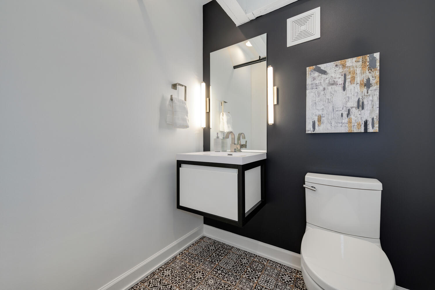 1000 West Washington Boulevard, Unit 148 Chicago, IL 60607 - Photo 28 of 29 a bathroom with a toilet a sink and mirror