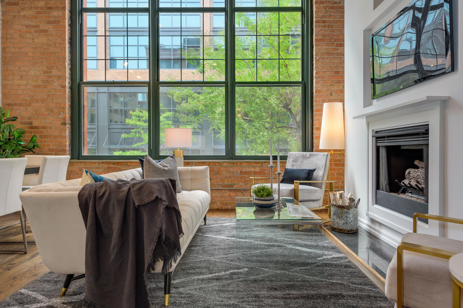 1000 West Washington Boulevard, Unit 148 Chicago, IL 60607 - Photo 9 of 29 a living room with furniture and a fireplace