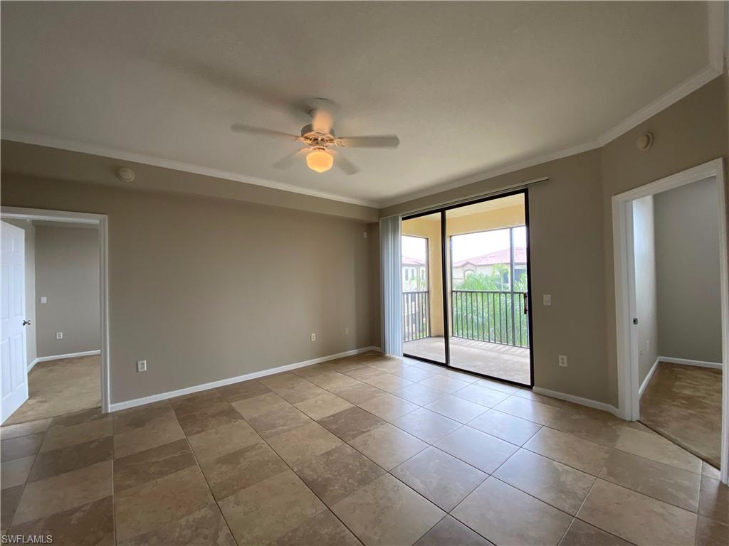 12940 Positano Circle, Unit 202 Naples, FL 34105 - Photo 2 of 33 a view of an empty room with a window