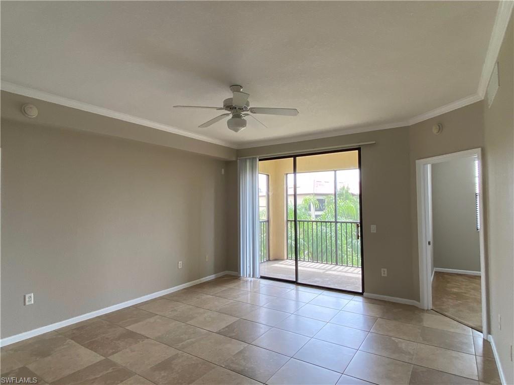 12940 Positano Circle, Unit 202 Naples, FL 34105 - Photo 3 of 33 a view of an empty room with a window