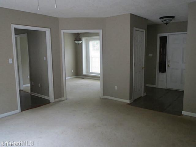 110 Aaron Road Elkin, NC 28621 - Photo 3 of 16 Entry. The foyer opens to family room, dining room and kitchen. Half bath is located off foyer.