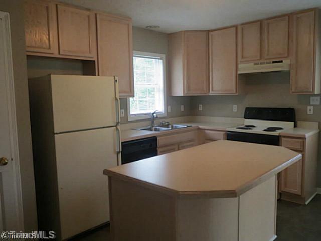 110 Aaron Road Elkin, NC 28621 - Photo 4 of 16 Kitchen. The kitchen features work island and opens to dining room and family room.