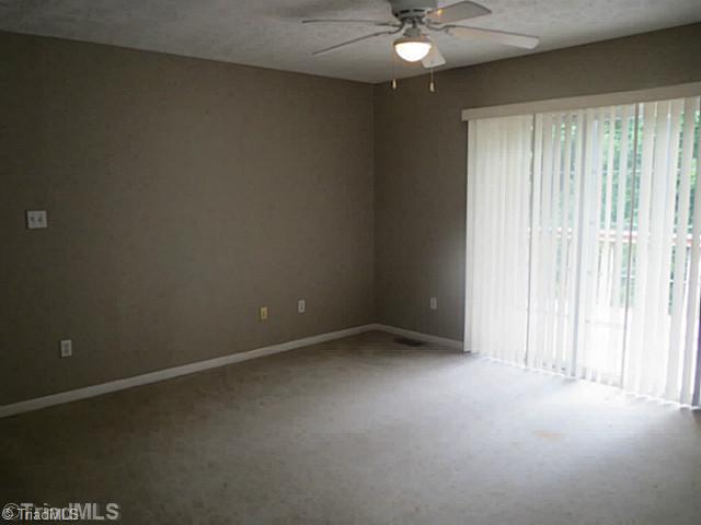 110 Aaron Road Elkin, NC 28621 - Photo 6 of 16 Den/Family/Great Room. The family room is the heart of this home and features sliding glass doors providing access to the deck and wooded back yard.