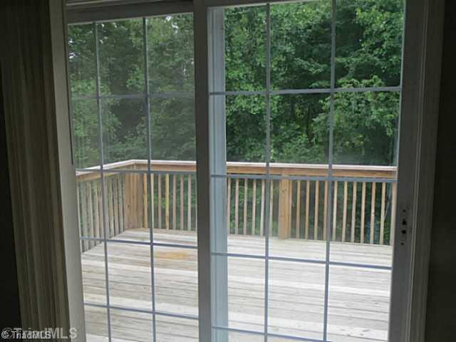 110 Aaron Road Elkin, NC 28621 - Photo 7 of 16 Patio/Deck. View from family room of deck and wooded back yard.
