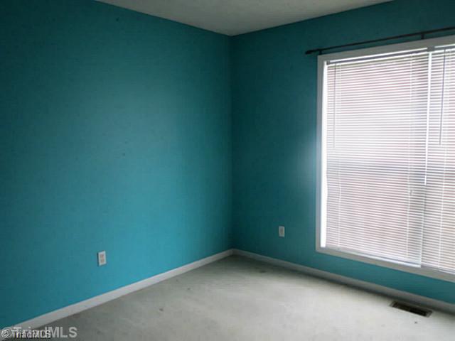 110 Aaron Road Elkin, NC 28621 - Photo 8 of 16 2nd Bedroom. Second bedroom features large double windows for lots of natural light.