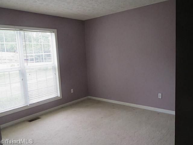 110 Aaron Road Elkin, NC 28621 - Photo 9 of 16 3rd Bedroom. Third bedroom features large double windows for lots of natural light.