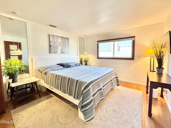 a bedroom with a bed and a table in it