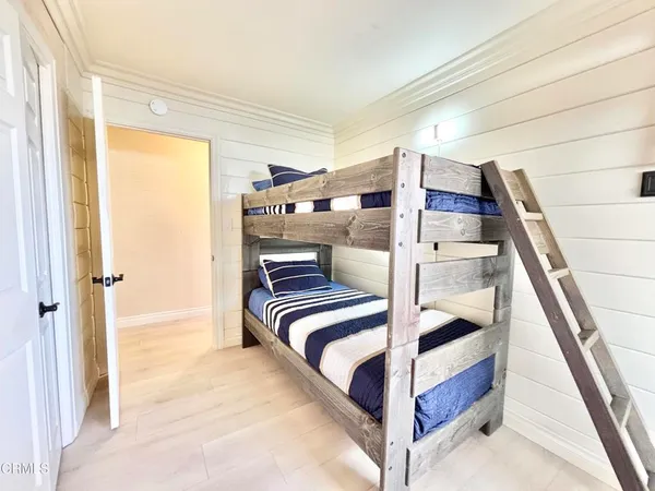 a view of bedroom with furniture and window