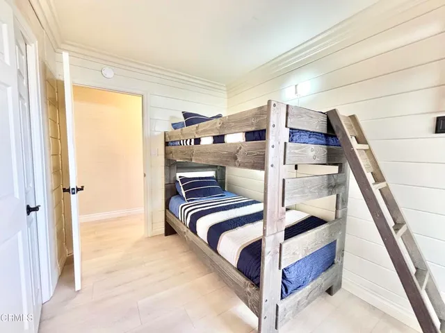 a view of bedroom with furniture and window