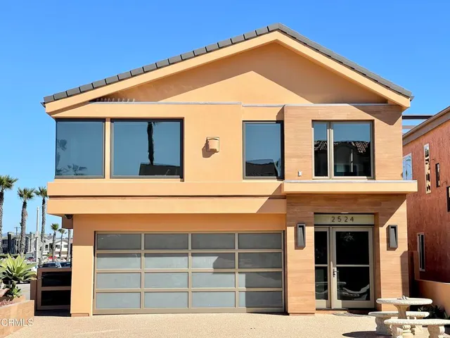 a front view of a house with garage