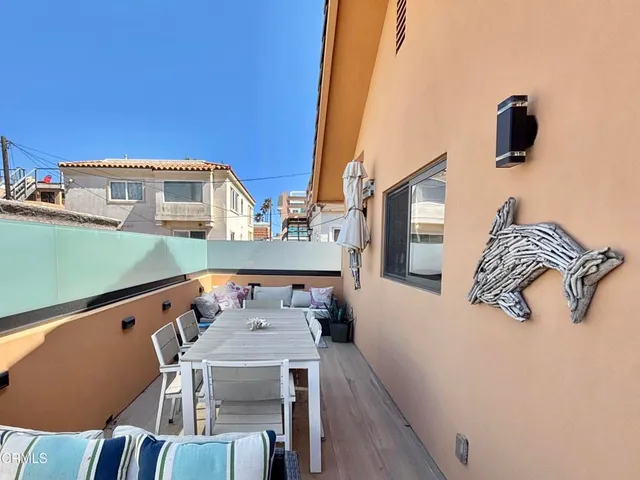 a view of a bench in front of a house