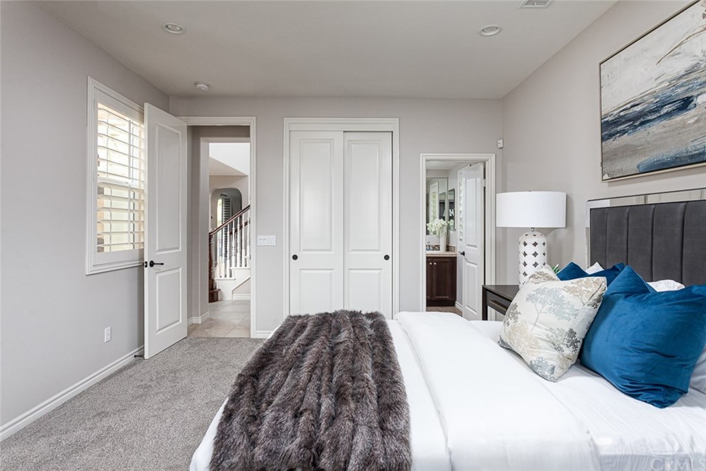 3932 Killymoon Circle Yorba Linda, CA 92886 - Photo 14 of 25 a bedroom with a bed and a mirror